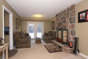Family Room with stone fireplace - Country homes for sale and luxury real estate including horse farms and property in the Caledon and King City areas near Toronto